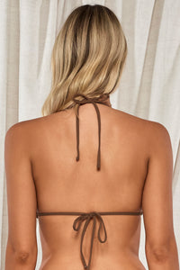 Back pose #1 of Jessica wearing Swim Systems Cocoa Daisy Eyelet Pom Pom Triangle Top