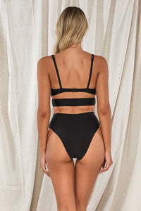 Back pose #1 of Jessica wearing Swim Systems Black Kaia Top