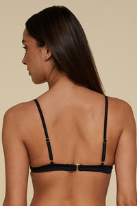 Back pose #1 of Jaida wearing B Swim Black Depth Meridian Underwire Top