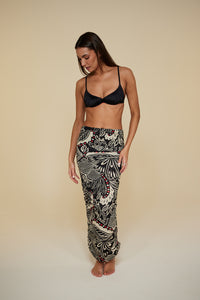 Front pose #1 of Jaida wearing B Swim  Miyajima Caspian Cover-Up as a skirt paired with Black Depth Meridian Underwire Top