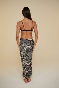 Back pose #1 of Jaida wearing B Swim  Miyajima Caspian Cover-Up as a skirt paired with Black Depth Meridian Underwire Top