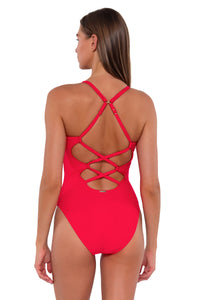 Back pose #1 of Daria wearing Sunsets Geranium Veronica One Piece showing crossback straps