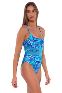 Side pose #1 of Daria wearing Sunsets Seaside Vista Alexia One Piece