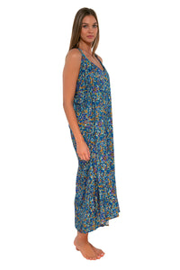 Side pose #1 of Daria wearing Sunsets Pansy Fields Destination Dress