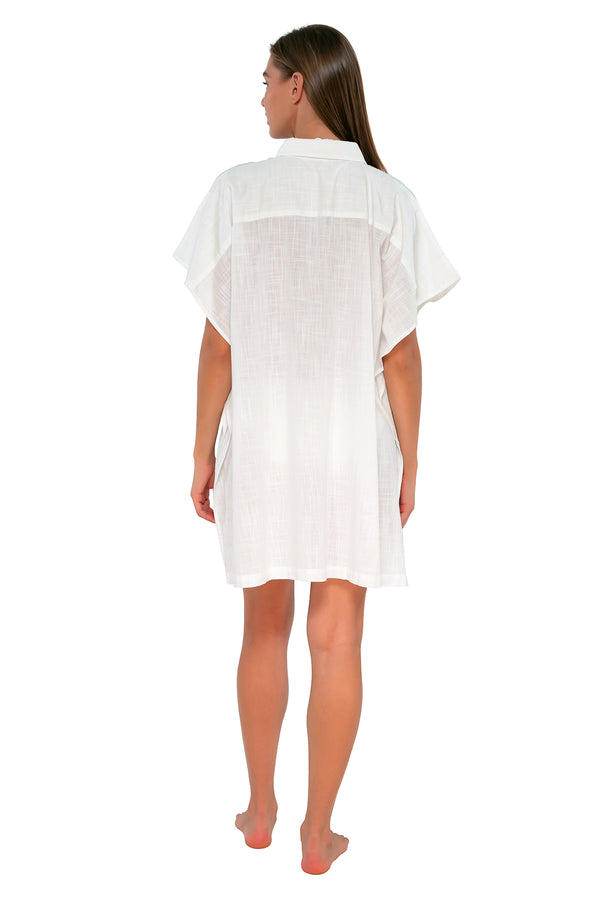 Back pose #1 of Daria wearing Sunsets White Lily Shore Thing Tunic