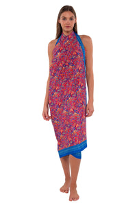 Front pose #1 of Daria wearing Sunsets Rue Paisley Paradise Pareo as a cross-neck halter cover-up
