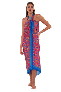 Front pose #2 of Daria wearing Sunsets Rue Paisley Paradise Pareo as a halter cover-up