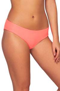 Side view of Sunsets Neon Coral Alana Hipster Bottom showing reversible wear