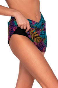 Side view of Sunsets Panama Palms Summer Lovin Swim Skirt lifted to show attached swim shorts