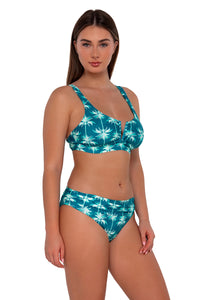 Side pose #1 of Taylor wearing Sunsets Palm Beach Vienna V-Wire Top paired with Unforgettable Bottom swim hipster