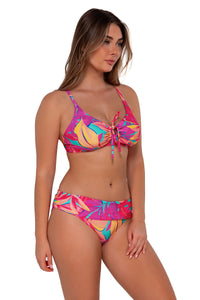 Side pose #1 of Taylor wearing Sunsets Oasis Sandbar Rib Kauai Keyhole Top paired with Unforgettable Bottom swim hipster