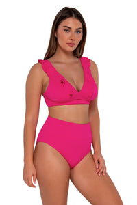 Side pose #1 of Taylor wearing Sunsets Begonia Sandbar Rib Hannah High Waist Bottom paired with Willa Wireless bikini top