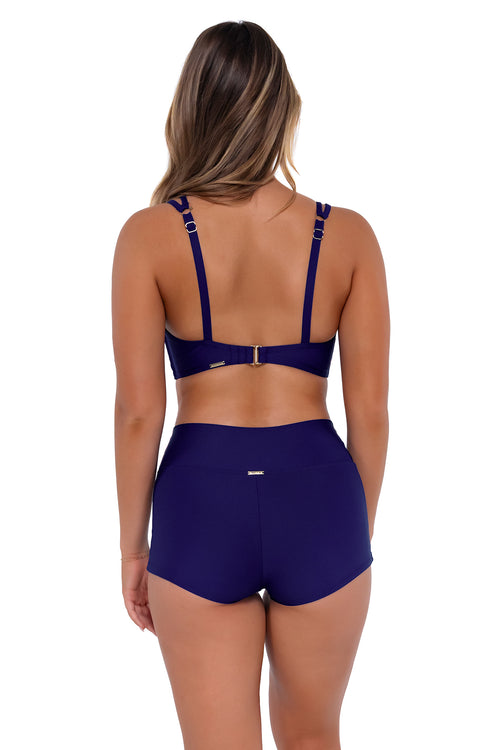 Back pose #1 of Taylor wearing Sunsets Indigo Kinsley Swim Short with matching Taylor Bralette bikini top