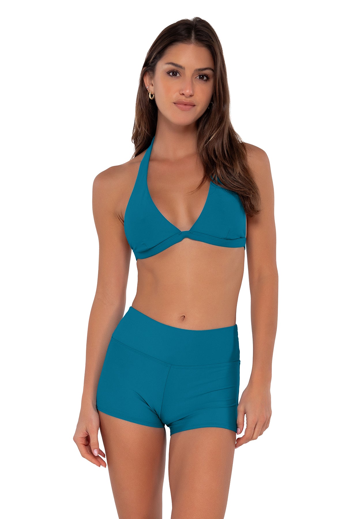 Front pose #1 of Gigi wearing Sunsets Avalon Teal Kinsley Swim Short paired with Faith Halter bikini top