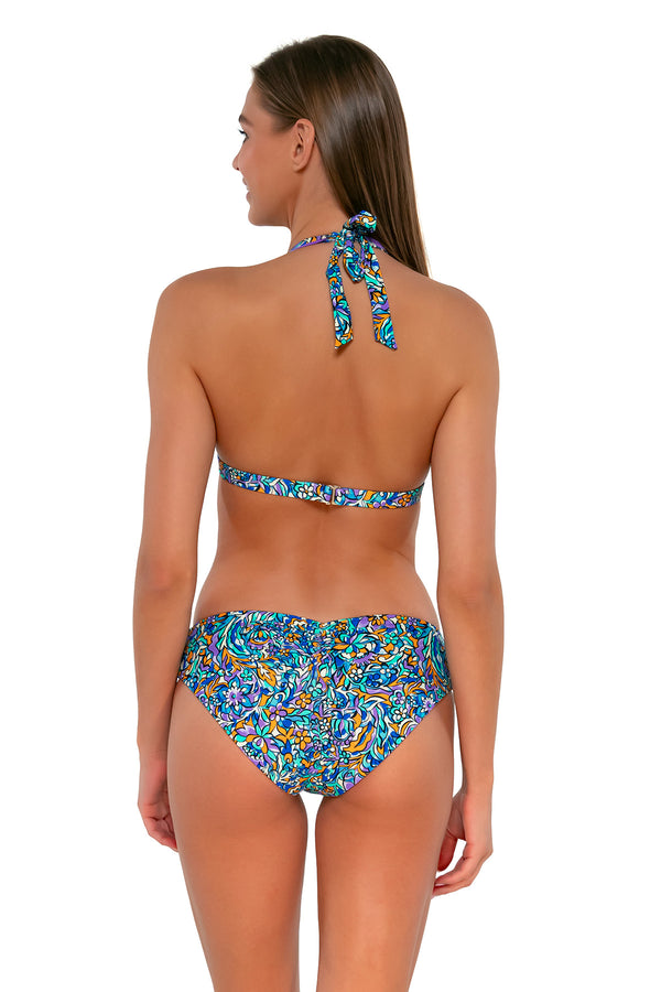 Back pose #1 of Daria wearing Sunsets Pansy Fields Faith Halter Top with matching Alana Reversible Hipster bikini bottom