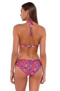 Back pose #1 of Daria wearing Sunsets Rue Paisley Alana Reversible Hipster Bottom with matching Faith Halter bikini top