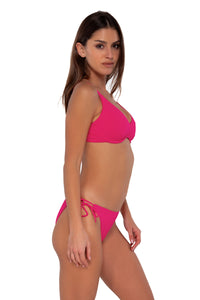 Side pose #1 of Gigi wearing Sunsets Begonia Sandbar Rib Brooke U-Wire Top paired with Everlee Tie Side bikini bottom