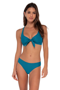 Front pose #1 of Gigi wearing Sunsets Avalon Teal Brandi Bralette Top showing bralette front tie paired with Collins Hipster bikini bottom