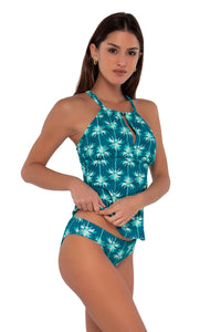 Side pose #1 of Gigi wearing Sunsets Palm Beach Mia Tankini Top lifted to show matching Collins Hipster bikini bottom