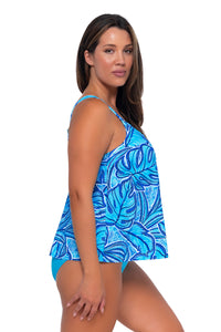 Side pose #1 of Nicky wearing Sunsets Escape Seaside Vista Sadie Tankini Top with matching Hannah High Waist bikini bottom