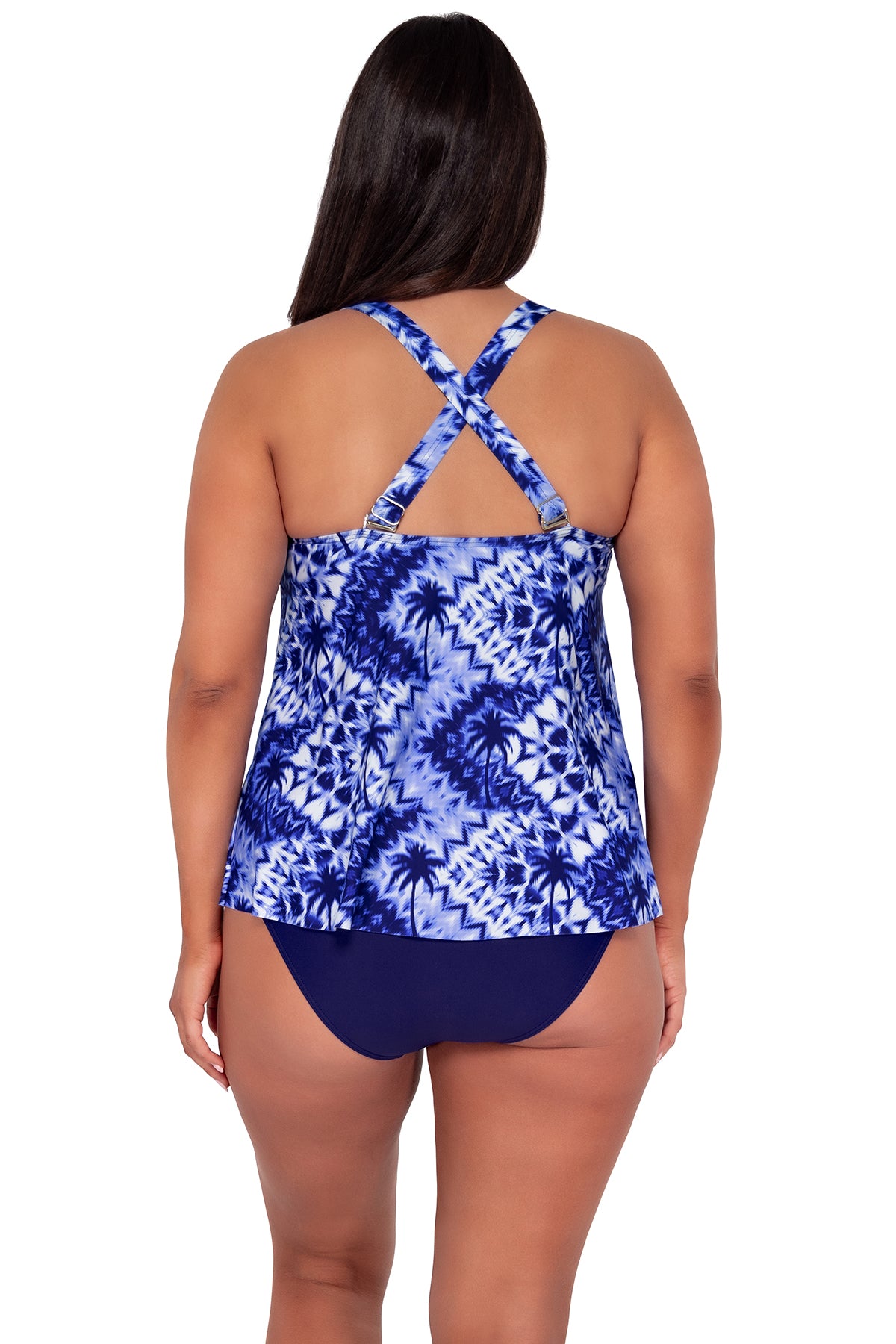 Back pose #1 of Nicki wearing Sunsets Escape Tulum Sadie Tankini Top showing crossback straps paired with Indigo Hannah High Waist