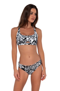 Side pose #1  of Gigi wearing Sunsets Caribbean Seagrass Texture Brandi Bralette Top with matching Audra Hipster bikini bottom