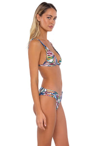 Side pose #1 of Jessica wearing Swim Systems Wild Wanderer Charlotte Top with matching Saylor Hipster bikini bottom