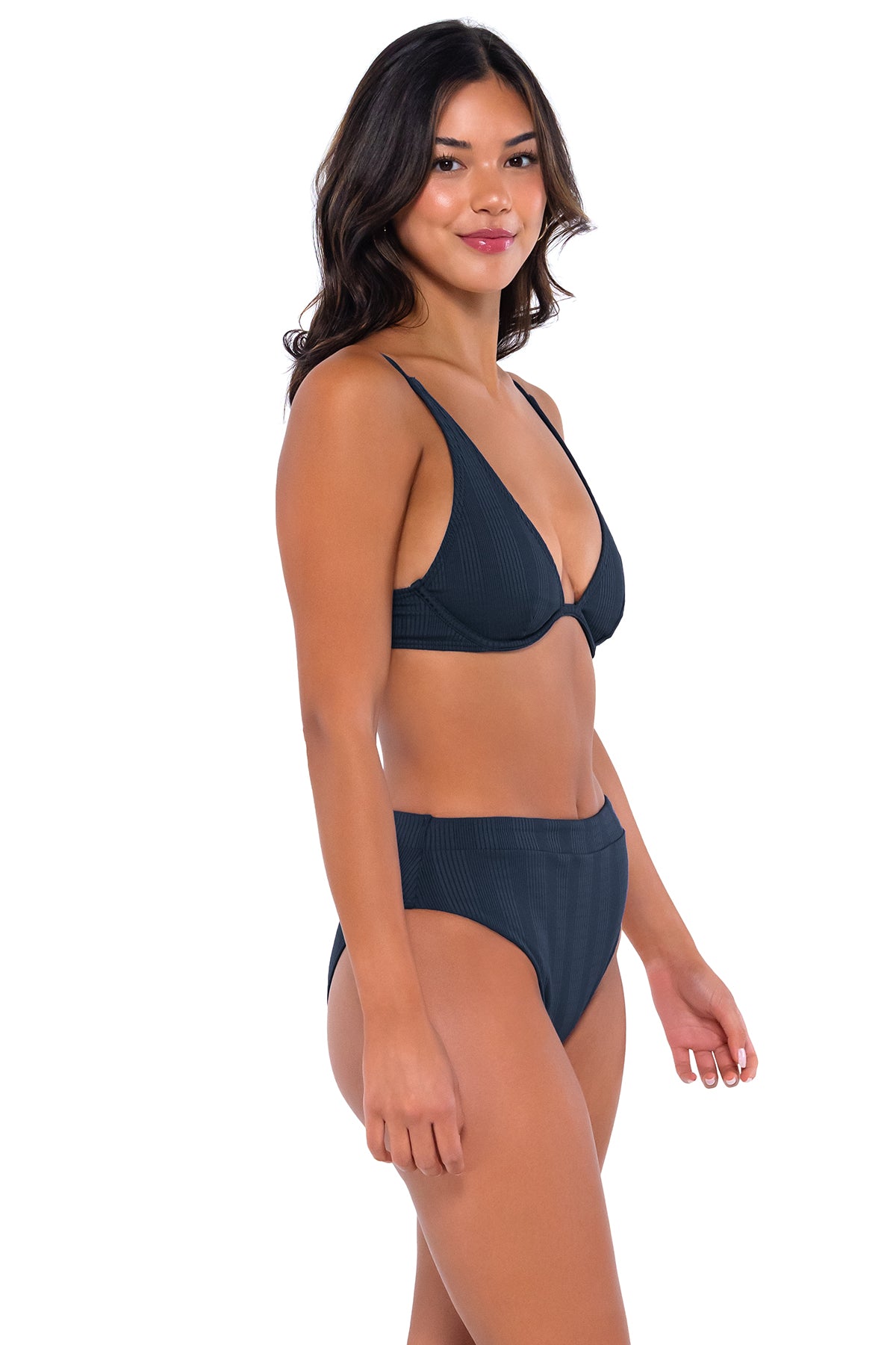 Side pose #1 of Chonzie wearing B Swim Navy Baja Rib Margot Bottom paired with Wyatt over the shoulder bikini