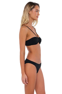 Side pose #1 of Jessica wearing B Swim Black Baja Rib Anisa Top with matching Ryder bikini bottom