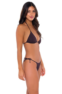 Side pose #1 of Chonzie wearing B Swim Java Flat Rib Jaelyn Bottom with matching Bermuda Triangle bikini top